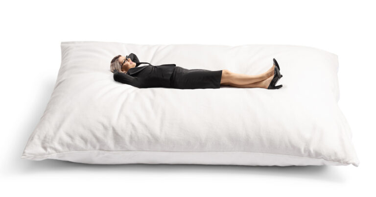 Businesswoman lying on a pillow